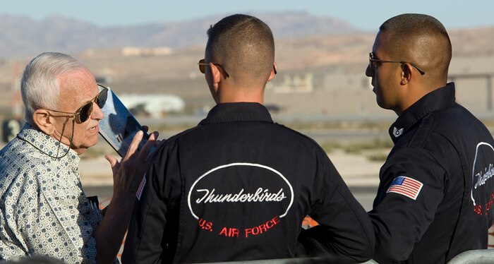 NELLIS AIR FORCE BASE, Nev.--  Imre Brassoi, a volunteer with the Nevada State Veterans Homes of Boulder City, speaks to Staff Sgt. Brandon Bingham and Tech. Sgt. Jose Hidalgo, Assistant Crew Chiefs both assigned to the U.S. Air Force Air Demonstration Squadron "Thunderbirds," during the 2010 Aviation Nation Nellis Open House Nov. 12. The Open House is an opportunity for the Las Vegas community to view aerial demonstrations and static displays of various aircraft from the military. The open house also acts as the final air show of the year for the  U.S. Air Force Air Demonstration Squadron "Thunderbirds." (U.S Air Force Photo / Senior Airman Stephanie Rubi) ( Released)