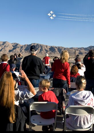 NELLIS AIR FORCE BASE, Nev.--  Family and friends of military members watch the U.S. Air Force Air Demonstration Squadron "Thunderbirds," during the  2010 Aviation Nation Nellis Open House Nov. 12. The Open House is an opportunity for the Las Vegas community to view aerial demonstrations and static displays of various aircraft from the military. The open house also acts as the final air show of the year for the  U.S. Air Force Air Demonstration Squadron "Thunderbirds." (U.S Air Force Photo / Senior Airman Stephanie Rubi) (Released)