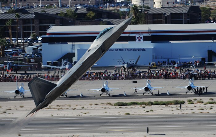 NELLIS AIR FORCE BASE, Nev.-- An F-22 Raptor performs a max climb take off during the 2010 Aviation Nation Nellis Open House Nov. 12. The Nellis Open House is an opportunity for the Las Vegas community to view aerial demonstrations and static displays of various aircraft from the military. The open house also acts as the final air show of the year for the  U.S. Air Force Air Demonstration Squadron "Thunderbirds." (U.S. Air Force photo/ Master Sgt. Kevin J. Gruenwald) (Released)



