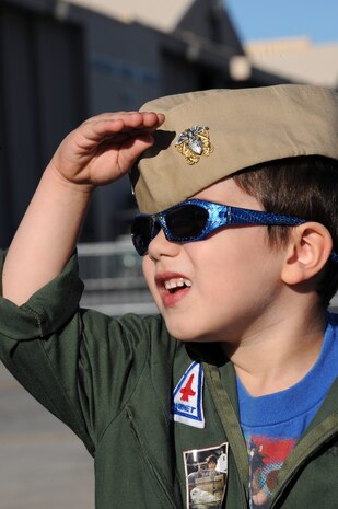 NELLIS AIR FORCE BASE, Nev. --  David Reymore salutes as the Air Combat Command Heritage Flight flies overhead during the 2010 Aviation Nation Nellis Open House Nov. 12. The Nellis Open House is an opportunity for the Las Vegas community to view aerial demonstrations and static displays of various aircraft from the military. The open house also acts as the final air show of the year for the  U.S. Air Force Air Demonstration Squadron "Thunderbirds."  (U.S. Air Force photo by Senior Airman Brett Clashman/Released)