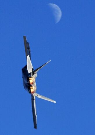 NELLIS AIR FORCE BASE, Nev. -- An F-22 Raptor flies over during the 2010 Aviation Nation Nellis Open House Nov. 12. The Nellis Open House is an opportunity for the Las Vegas community to view aerial demonstrations and static displays of various aircraft from the military. The open house also acts as the final air show of the year for the  U.S. Air Force Air Demonstration Squadron "Thunderbirds." (U.S. Air Force photo by Airman 1st Class Daniel Hughes/Released)
