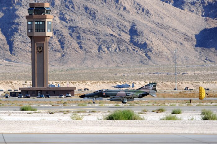 NELLIS AIR FORCE BASE, Nev.-- An F-4 Phantom lands on the runway after participating in the Air Combat Command heritage flight at the 2010 Aviation Nation Nellis Open House Nov. 12, 2010. The Nellis Open House is an opportunity for the Las Vegas community to view aerial demonstrations and static displays of various aircraft from the military. The open house also acts as the final air show of the year for the  U.S. Air Force Air Demonstration Squadron "Thunderbirds." (U.S. Air Force photo / Airman 1st Class Matthew Lancaster)(Released)

