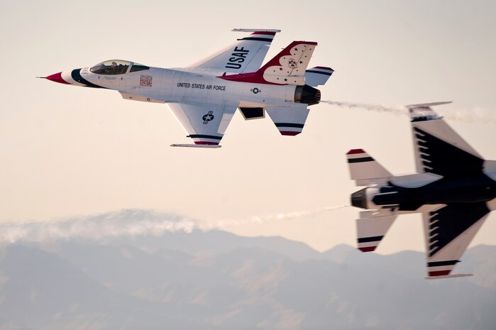 NELLIS AIR FORCE BASE, Nev. -- The United States Air Force Air Demonstration Squadron "Thunderbirds," opposing solos demonstrate the knife-edge pass
during the 2010 Aviation Nation Nellis Open House Nov. 12. The Nellis Open House is an opportunity for the Las Vegas community to view aerial demonstrations and static displays of various aircraft from the military. The open house also acts as the final air show of the year for the  U.S. Air Force Air Demonstration Squadron "Thunderbirds."(U.S. Air Force photo by Tech. Sgt. Michael R. Holzworth)(Released)
