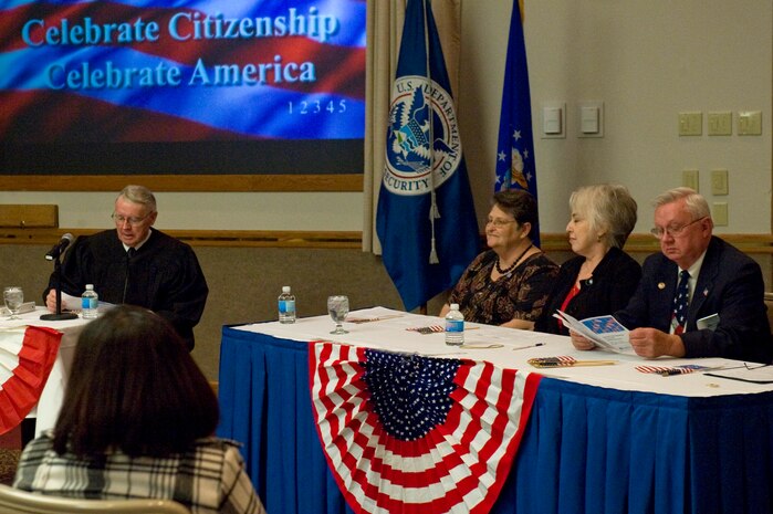 NELLIS AIR FORCE BASE, Nev.-- United States District Court Judge Lloyd George presides over the Special Naturalization Ceremony at the Nellis Officer's Club, Nov. 12, 2010. People representing 12 different countries became United States citizens. (U.S. Air Force Photo by Airman 1st Class Jamie Nicley/Released)