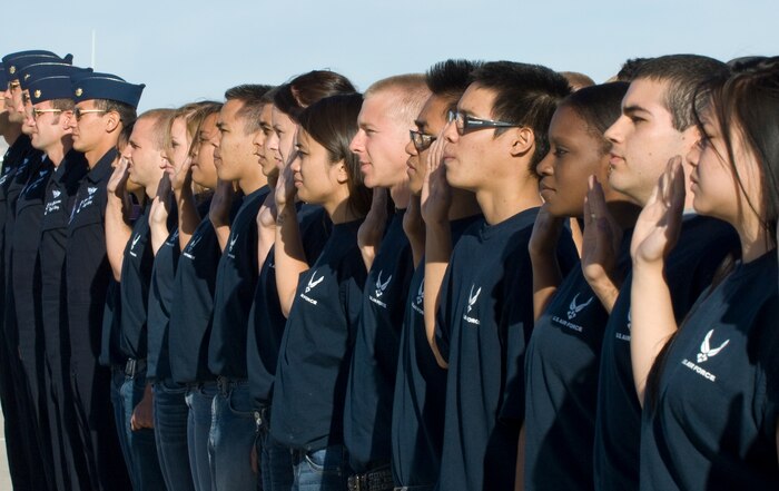 NELLIS AIR FORCE BASE, Nev.--  Members from the Delayed Entry Program recite the oath of enlistment in front of air show spectators during the 2010 Aviation Nation Nellis Open House Nov. 13, 2010. The Nellis Open House is an opportunity for the Las Vegas community to view aerial demonstrations and static displays of various aircraft from the military. The open house also acts as the final air show of the year for the U.S. Air Force Air Demonstration Squadron "Thunderbirds." (U.S Air Force Photo / Senior Airman Stephanie Rubi) (Released)