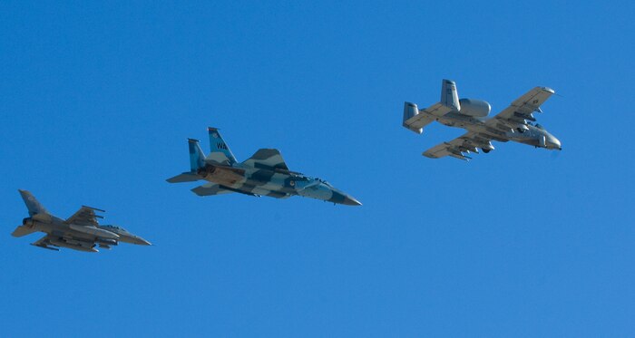 NELLIS AIR FORCE BASE, Nev.--  An F-16 Falcon, an F-15 Eagle, and an A-10 Thunderbolt II fly overhead during the 2010 Aviation Nation Nellis Open House Nov. 13, 2010. The Nellis Open House is an opportunity for the Las Vegas community to view aerial demonstrations and static displays of various aircraft from the military. The open house also acts as the final air show of the year for the  U.S. Air Force Air Demonstration Squadron "Thunderbirds." (U.S Air Force Photo / Senior Airman Stephanie Rubi)(Released)