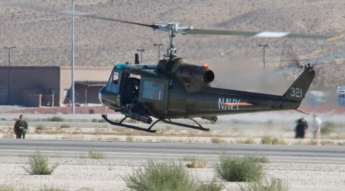 NELLIS AIR FORCE BASE, Nev.--  Senior Airman Jose Martinez, 99th Air Base Wing weapons safety manager, plays the role of a down pilot rescued by an TH-1H Huey II helicopter during the 2010 Aviation Nation Nellis Open House Nov. 13 2010. The Nellis Open House is an opportunity for the Las Vegas community to view aerial demonstrations and static displays of various aircraft from the military. The open house also acts as the final air show of the year for the  U.S. Air Force Air Demonstration Squadron "Thunderbirds." (U.S Air Force Photo / Senior Airman Stephanie Rubi) (Released)
