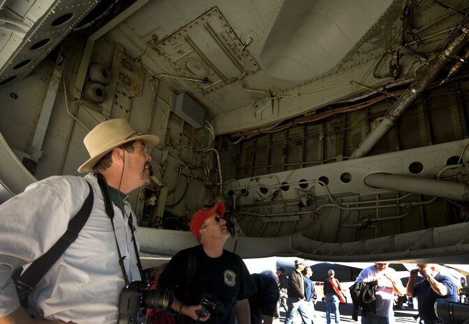 NELLIS AIR FORCE BASE, Nev.--  Randy Becker and David Thomas observe the bomb bay of a  B-52 Stratofortress from Barksdale Air Force Base, La., static display during the 2010 Aviation Nation Nellis Open House Nov. 13, 2010. The Nellis Open House is an opportunity for the Las Vegas community to view aerial demonstrations and static displays of various aircraft from the military. The open house also acts as the final air show of the year for the  U.S. Air Force Air Demonstration Squadron "Thunderbirds." (U.S Air Force Photo / Senior Airman Stephanie Rubi) (Released)