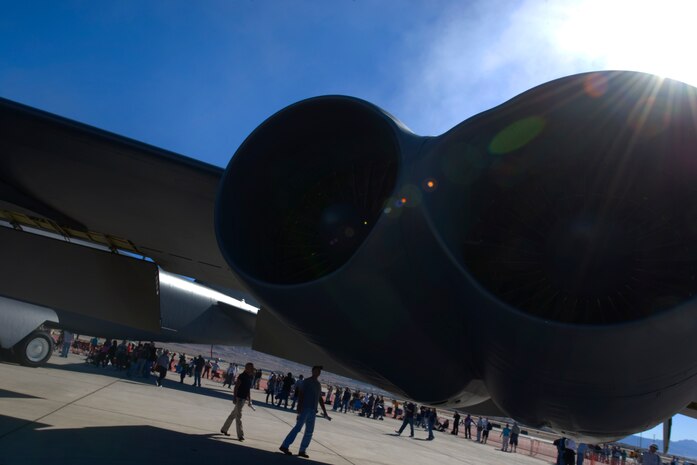 NELLIS AIR FORCE BASE, Nev.--  Spectators walk beneath a B-52 Stratofortress from Barksdale Air Force Base, La., static display during the 2010 Aviation Nation Nellis Open House Nov. 13, 2010. The Open House at Nellis Air Force Base is the largest free public event in Nevada which provides the opportunity for the Las Vegas community to view aerial demonstrations and static displays of various aircraft from the military. The open house also acts as the final air show of the year for the  U.S. Air Force Air Demonstration Squadron "Thunderbirds." (U.S Air Force Photo / Senior Airman Stephanie Rubi) (Released)