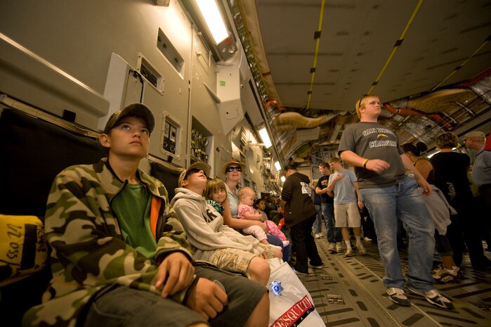 NELLIS AIR FORCE BASE, Nev.--  The Ketner family observes the inside of a C-17 Globemaster III during the 2010 Aviation Nation Nellis Open House Nov. 13, 2010. The  Open House at Nellis Air Force Base is the largest free public event in Nevada which provides the opportunity for the Las Vegas community to view aerial demonstrations and static displays of various aircraft from the military. The open house also acts as the final air show of the year for the U.S. Air Force Air Demonstration Squadron "Thunderbirds." (U.S Air Force Photo / Senior Airman Stephanie Rubi) (Released)