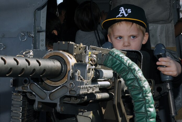 NELLIS AIR FORCE BASE, Nev. --  Steven Angel operates a .50 caliber machine gun during the 2010 Aviation Nation Nellis Open House Nov. 13. The Nellis Open House is an opportunity for the Las Vegas community to view aerial demonstrations and static displays of various aircraft from the military. The open house also acts as the final air show of the year for the  U.S. Air Force Air Demonstration Squadron "Thunderbirds." (U.S. Air Force photo by Senior Airman Brett Clashman)(Released)