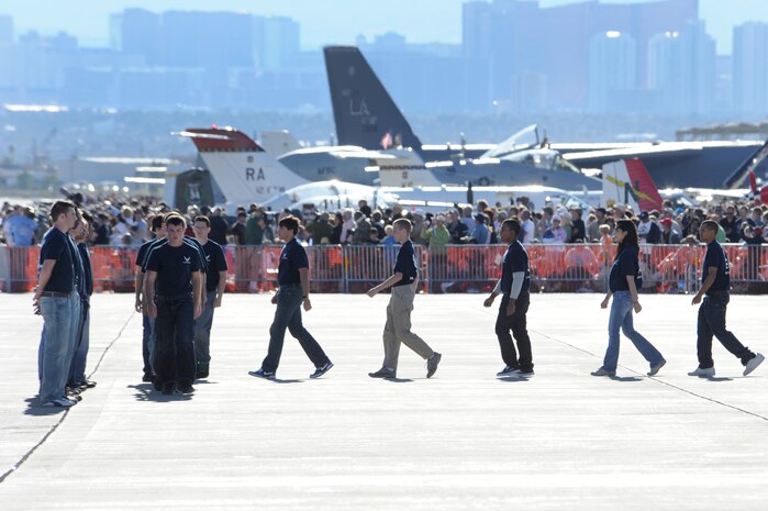 NELLIS AIR FORCE BASE, Nev.-- Members of the U.S. Air Force Delayed Entry Program form up to recite the oath of enlistment at the 2010 Aviation Nation Nellis Open House Nov. 13.  The Open House is an opportunity for the Las Vegas community to view aerial demonstrations and static displays of various aircraft from the military. The open house also acts as the final air show of the year for the  U.S. Air Force Air Demonstration Squadron "Thunderbirds." (U.S Air Force Photo / Airman 1st Class Matthew Lancaster/Released)