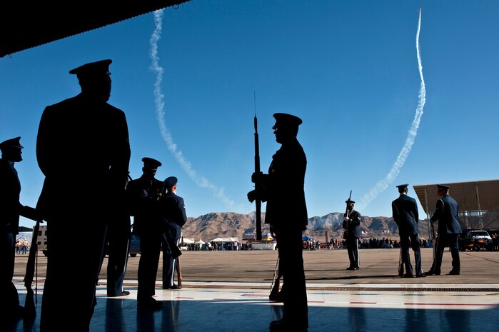 NELLIS AIR FORCE BASE, Nev.-- The U.S. Air Force Honor Guard Drill Team from Bolling Air Force Base Washington D.C. prepares in a hanger before a performance on Nov. 13, 2010. The performance was  part of the 2010 Aviation Nation Nellis Open House. The weekend long event is an opportunity for the Las Vegas community to view aerial demonstrations and static displays of various aircraft from the military. The open house also acts as the final air show of the year for the  U.S. Air Force Air Demonstration Squadron "Thunderbirds." (U.S. Air Force photo by Tech. Sgt. Michael R. Holzworth)(Released)
