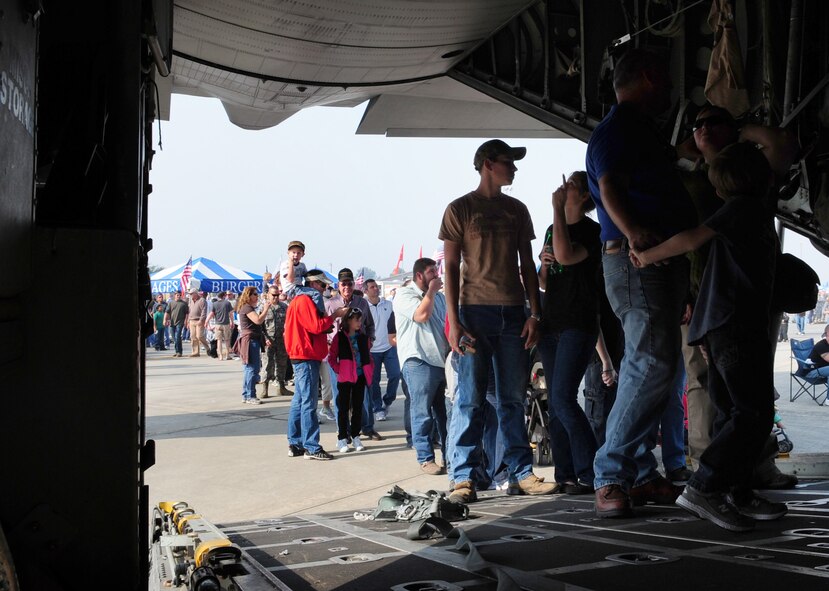 MOODY AIR FORCE BASE, Ga.-- Members from the local community line up to see an HC-130 Combat King during the Moody Community Appreciation Day Air Show Nov. 13. Thousands of people lined up to see the different types of aircraft used today and previous eras. (U.S. Air Force photo/Senior Airman Stephanie Longoria)(RELEASED)