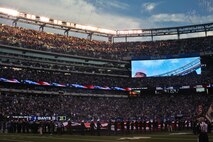 Marines, sailors, coast guardsmen and soldiers unfurl a large American flag is presented across the field at the New York Giants military appreciation game versus the Dallas Cowboys, Nov. 14.