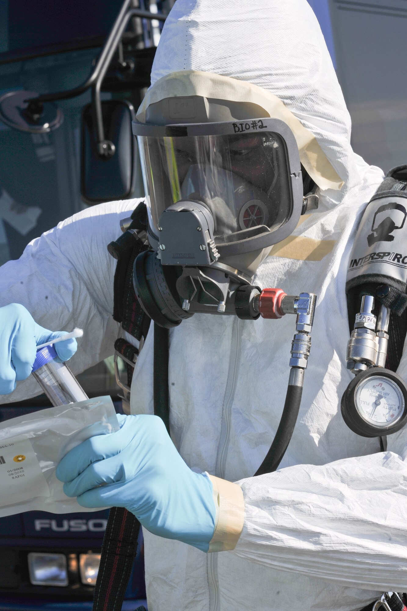 YOKOTA AIR BASE, Japan -- Staff Sgt. Shane Polk, 374th Aerospace Medicine Squadron, performs sampling of a simulated chemical agent here Nov. 16 during an Emergency Management Exercise. (U.S. Air Force photo/Osakabe Yasuo)