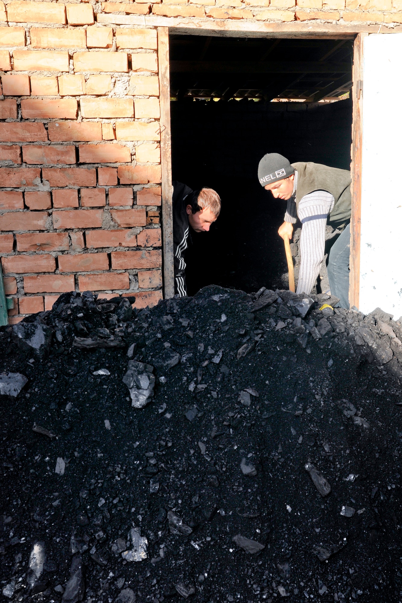 GRODZ VILLAGE, Kyrgyzstan - Five tons of coal was delivered Nov. 12 to the Grodz Kindergarten thank to noncommissioned officers belonging to the private organization called the 5/6 Council, Transit Center at Manas. Another five tons will be purchased in a few months to help the school stay open for the winter. (U.S. Air Force Photo/Staff Sgt. Nathan Bevier)
