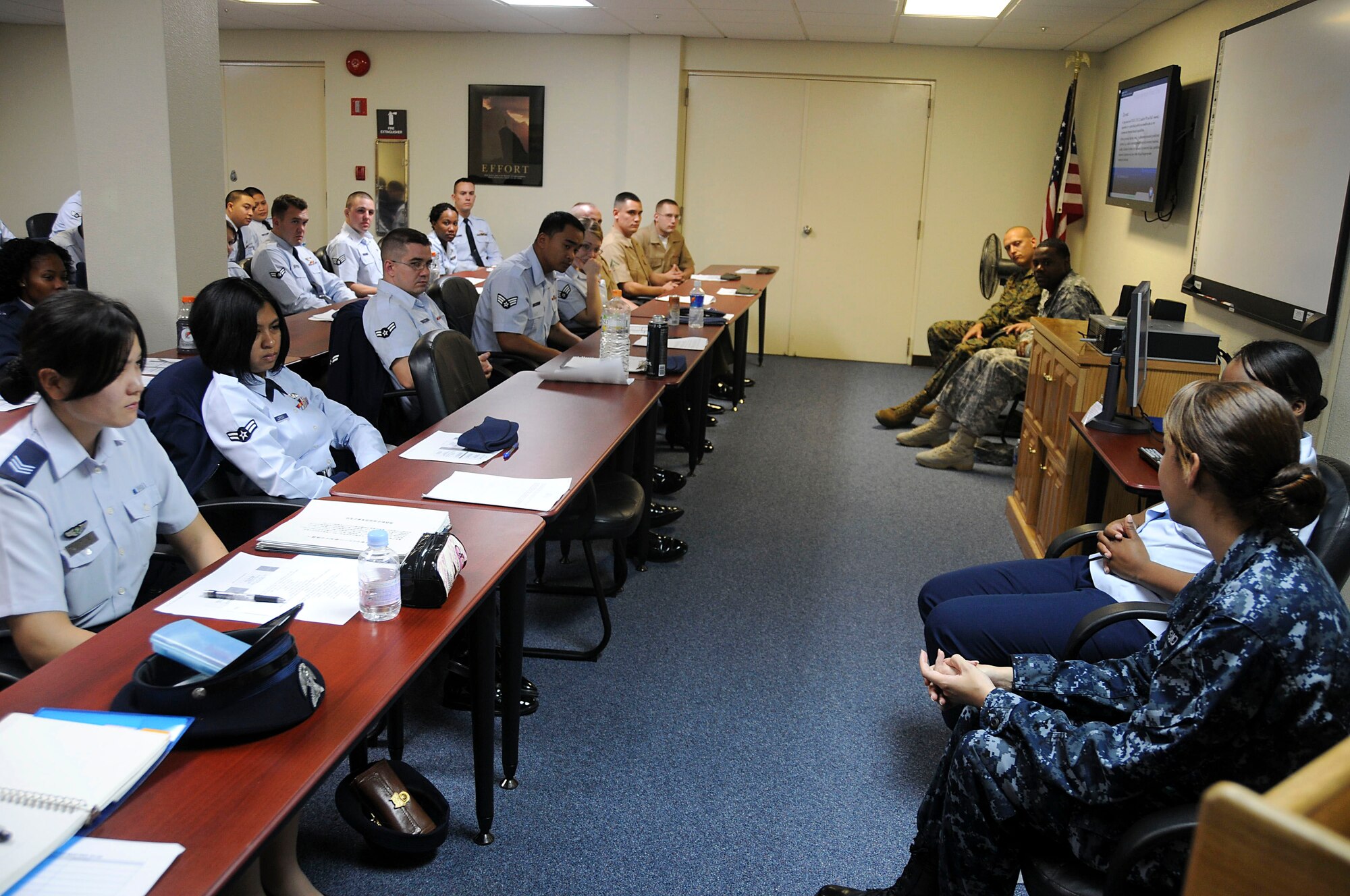 A panel made up of members from each branch of the military answer questions from servicemembers attending the Airman Professional Development Seminar at Kadena Air Base Nov. 15. The seminar was comprised of Airmen, Marines and JASDF members. (U.S. Air Force photo/Staff Sgt. Darnell T. Cannady)