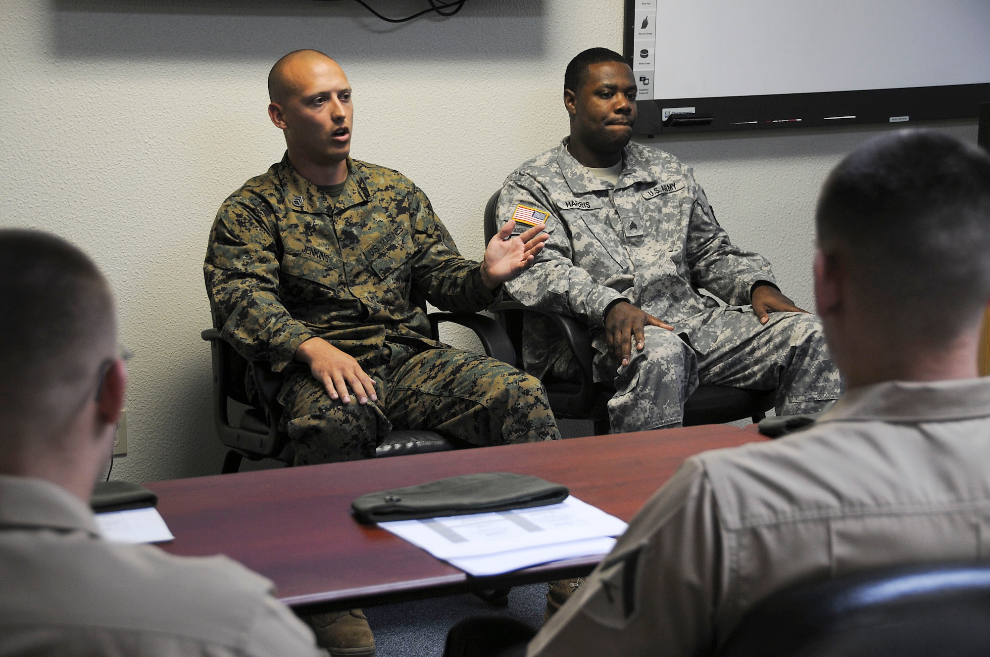 A panel made up of members from each branch of the military answer questions from servicemembers attending the Airman Professional Development Seminar at Kadena Air Base Nov. 15. Although the seminar is open to all services, this is the first time Marines have attended the course. (U.S. Air Force photo/Staff Sgt. Darnell T. Cannady)