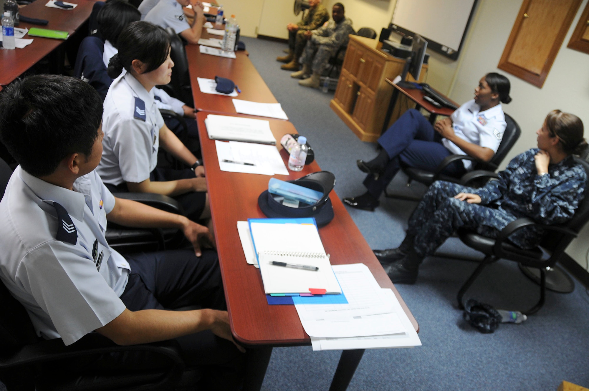 A panel consisting of members from each branch of the military answers questions from Airman Professional Development Seminar students at Kadena Air Base Nov. 15. This seminar, which is designed to develop future non-commissioned officers, is open to all services and Japan Air Self Defense Force members. (U.S. Air Force photo/Staff Sgt. Darnell T. Cannady)
