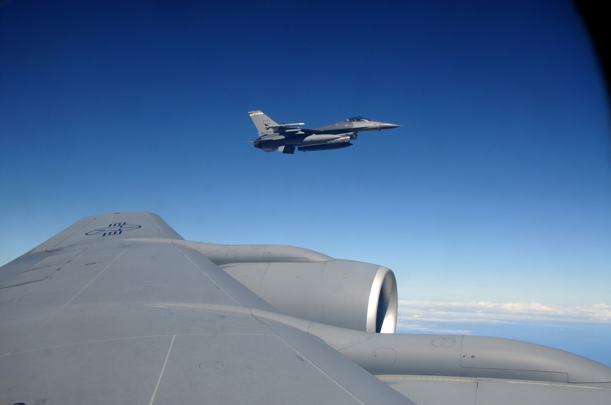 A U.S. Air Force F-16 Fighting Falcon from the 140th Fighter Wing, Buckley, Colo.,  flies off the wing  of a 161st Air Refueling Wing  KC-135 Stratotanker during a CRUZEX exercise on November 12, 2010 over Brazil. Both wings are participating in CRUZEX V, or Cruzeiro Do Sul (Southern Cross).  CRUZEX  is a multi-national combined exercise involving the Air Forces of Argentina, Brazil, Chile, France and Uruguay, and observers from numerous other countries with more than 82 aircraft and almost 3,000 Airmen involved.  U.S. Air Force Photo by Master Sgt. Kelly M. Deitloff