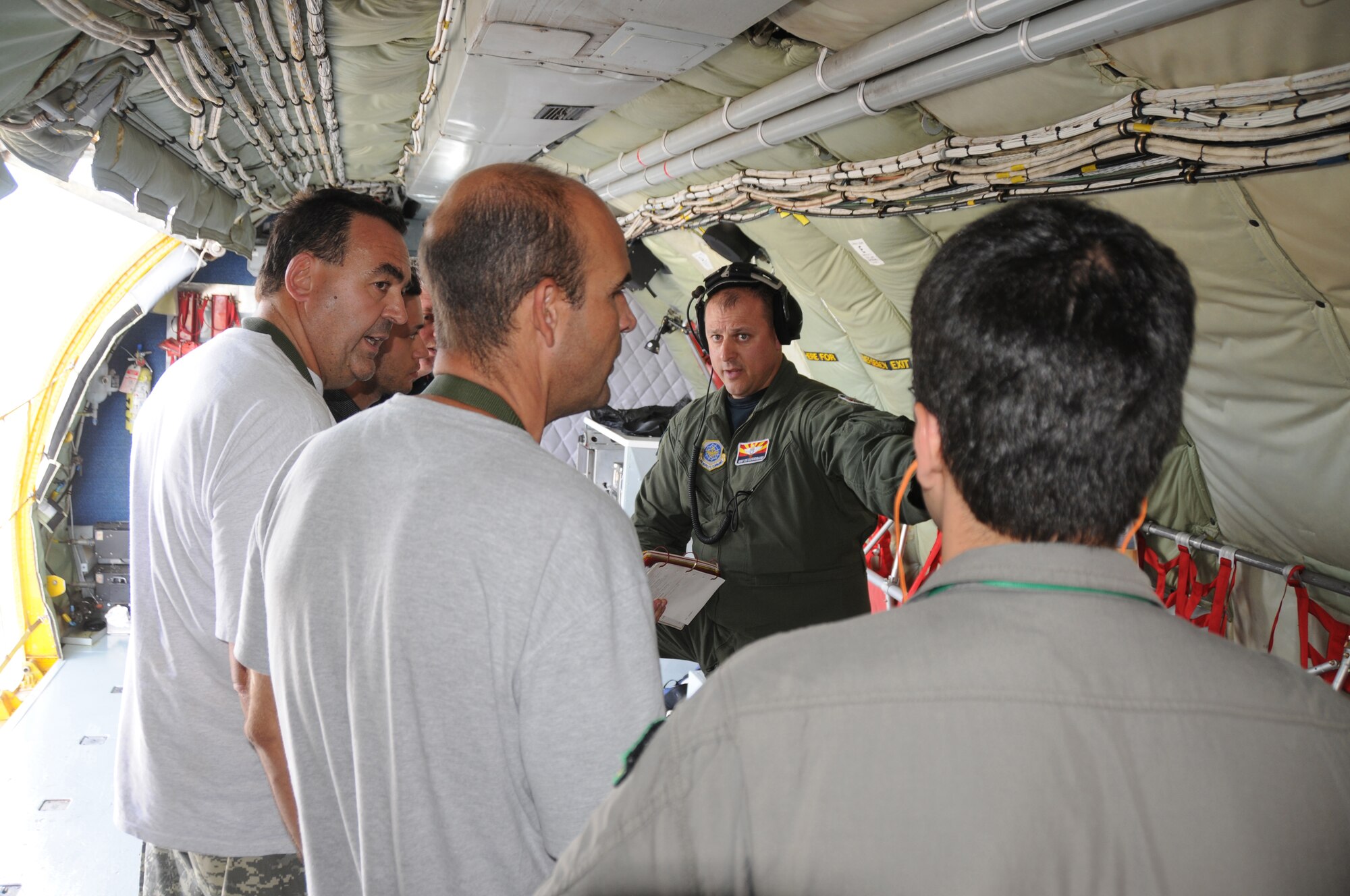 Master Sgt. Ken Daughenbaugh,  a boom operator for the 161st Air Refueling Wing, Phoenix Ariz.,  conducts a safety briefing to a local media crew before a refueling mission on November 12, 2010. The 161st ARW is participating in CRUZEX V, or Cruzeiro Do Sul (Southern Cross).  CRUZEX  is a multi-national combined exercise involving the Air Forces of Argentina, Brazil, Chile, France and Uruguay, and observers from numerous other countries with more than 82 aircraft and almost 3,000 Airmen involved. U.S. Air Force Photo by Master Sgt. Kelly Deitloff