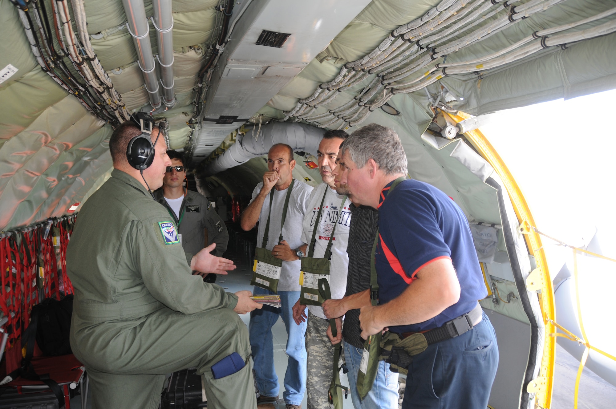 Master Sgt. Ken Daughenbaugh, a boom operator for the 161st Air Refueling Wing, Phoenix Ariz.,  conducts a safety briefing to a local media crew before a refueling mission on November 12, 2010. The 161st ARW is participating in CRUZEX V, or Cruzeiro Do Sul (Southern Cross).  CRUZEX  is a multi-national combined exercise involving the Air Forces of Argentina, Brazil, Chile, France and Uruguay, and observers from numerous other countries with more than 82 aircraft and almost 3,000 Airmen involved. U.S. Air Force Photo by Master Sgt. Kelly Deitloff