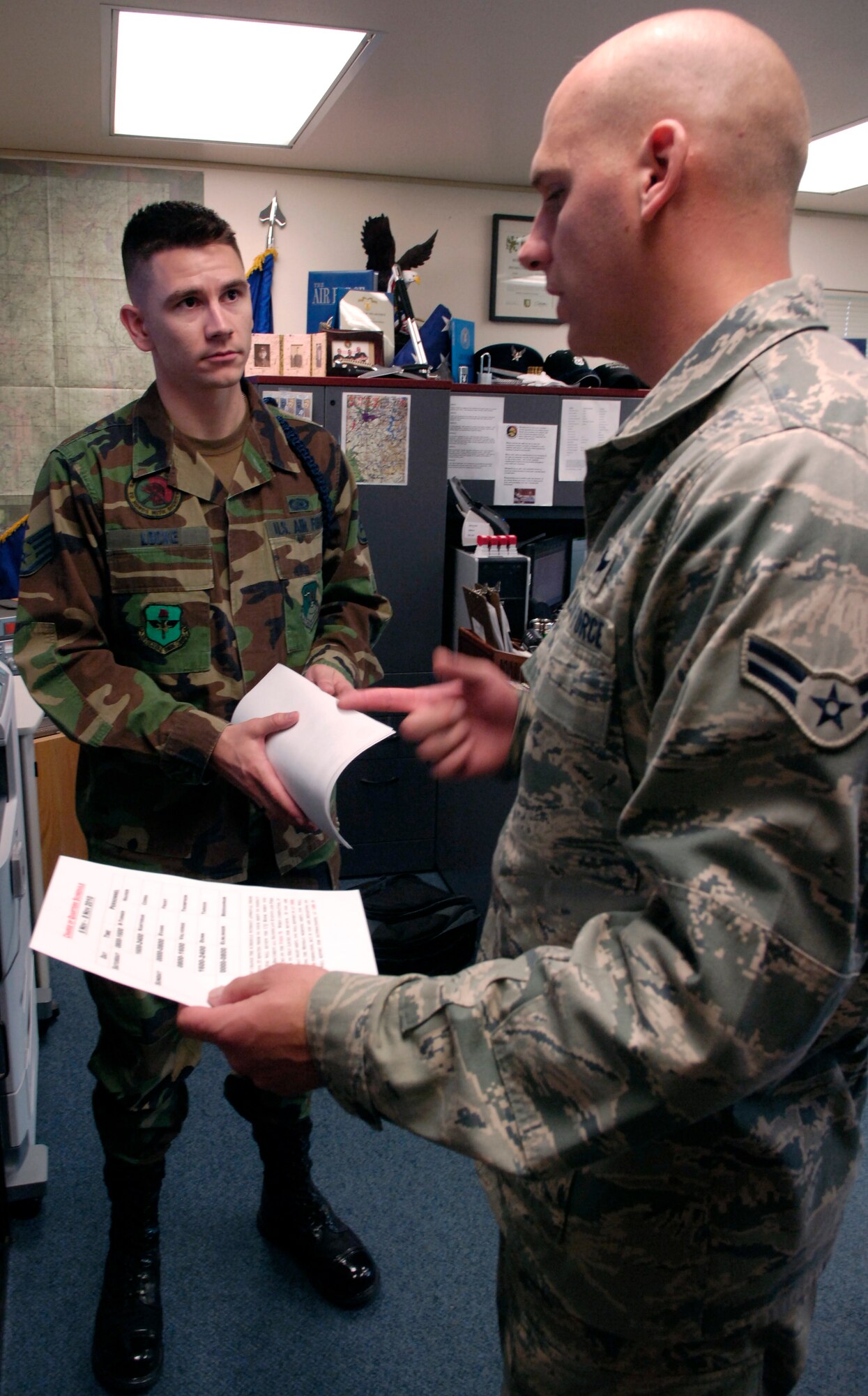 FAIRCHILD AIR FORCE BASE, Wash. -- Airman 1st Class Timothy Kantorak seeks guidance from Staff Sgt. Thomas Locke, 66th Training Squadron Military Training Leader Nov. 5, 2011 at the receiving survival, evasion, resistance and escape technical training school dormitory here. Airman Kantorak is attending the SERE tech school as a part of his requirements as a C-130 Loadmaster. Once he completes training here, he will move on to Pensacola, Fla. for water survival training and then to his duty station at Youngstown Ohio with the 910th Airlift Squadron. (U.S. Air Force photo/Airman 1st Class Natasha E. Stannard)