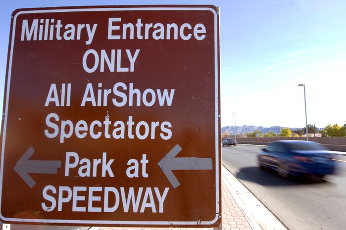 NELLIS AIR FORCE BASE, Nev.-- Military members enter through the front gate of Nellis AFB during the 2010 Aviation Nation Nellis Open House Nov. 14. The Nellis Open House is an opportunity for the Las Vegas community to view aerial demonstrations and static displays of various aircraft from the military. The open house also acts as the final air show of the year for the U.S. Air Force Air Demonstration Squadron, "Thunderbirds." (U.S Air Force Photo / Senior Airman Stephanie Rubi) (Released)