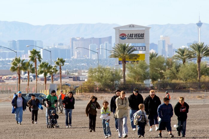 LAS VEGAS --  Spectators for the Nellis Air Force Base 2010 Aviation Nation Open House, park at the Las Vegas Motor Speedway and walk toward the shuttle bus to Nellis Nov 14.  The Nellis Open House is an opportunity for the Las Vegas community to view aerial demonstrations and static displays of various aircraft from the military. The open house also acts as the final air show of the year for the U.S. Air Force Air Demonstration Squadron, "Thunderbirds."  (U.S Air Force Photo / Senior Airman Stephanie Rubi) (Released)