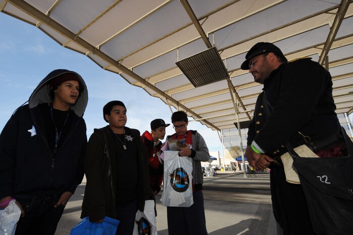 Jason Coffey President of the Southern Nevada Living History Association speaks to kids on the importance of our Nation?s history on Nov. 14, 2010 during Aviation Nation, Nellis Air Force Base Open House and annual Las Vegas air show.  The two-day event also depicts the history of American aviation and salutes the recent accomplishments of America's military in operations around the globe through numerous additional military and civilian ground displays. (U.S. Air Force photo/ Master Sgt. Kevin J. Gruenwald) released