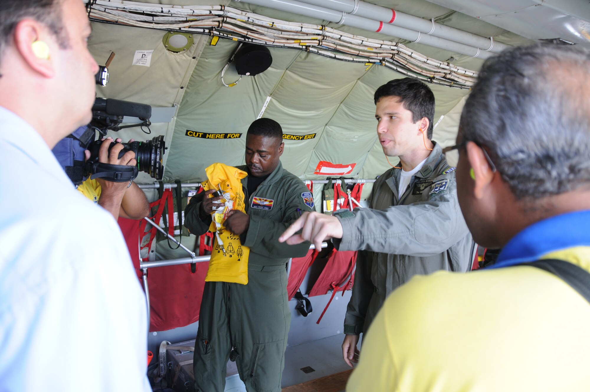 RECIFE, Brazil ? Master Sgt Vince Jones,  a boom operator for the 161st Air Refueling Wing, Phoenix Ariz., and LT Ortiz, a pilot for the Brazilian Air Force, give a safety briefing to a local media crew before a refueling mission on November 9, 2010. The 161st ARW is participating in CRUZEX V, or Cruzeiro Do Sul (Southern Cross).  CRUZEX  is a multi-national combined exercise involving the Air Forces of Argentina, Brazil, Chile, France and Uruguay, and observers from numerous other countries with more than 82 aircraft and almost 3,000 Airmen involved. U.S. Air Force Photo by Master Sgt. Kelly M. Deitloff