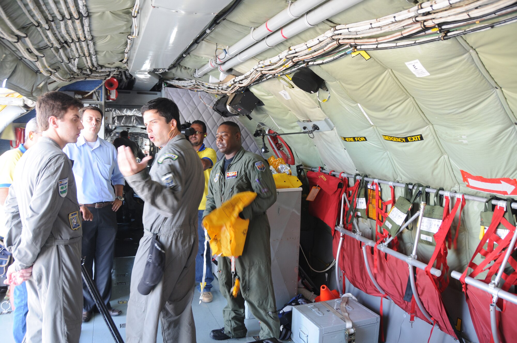 RECIFE, Brazil ? Master Sgt Vince Jones,  a boom operator for the 161st Air Refueling Wing, Phoenix Ariz., and LT Ortiz, a pilot for the Brazilian Air Force, give a safety briefing to a local media crew before a refueling mission on November 9, 2010. The 161st ARW is participating in CRUZEX V, or Cruzeiro Do Sul (Southern Cross).  CRUZEX  is a multi-national combined exercise involving the Air Forces of Argentina, Brazil, Chile, France and Uruguay, and observers from numerous other countries with more than 82 aircraft and almost 3,000 Airmen involved. U.S. Air Force Photo by Master Sgt. Kelly M. Deitloff