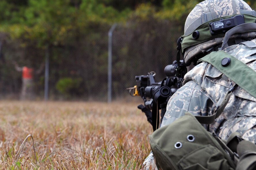 Tech. Sgt. Shawn Elmore, 2nd Security Forces Squadron, NCO in charge of pass and identification from Barksdale Air Force Base, La., challenges a scenario role player during the tactics portion of the Global Strike Challenge at Camp Minden, La., Nov. 13. More than 400 participants took part in GSC competitions at various locations on base. Teams have the opportunity to display their innovative thinking, teamwork and esprit de corps that are central to the GSC mission. (U.S. Air Force photo/Senior Airman Brittany Y. Bateman)(RELEASED)