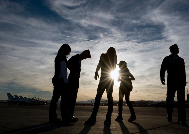 NELLIS AIR FORCE BASE, Nev. -- The U.S. Air Force Air Demonstration Squadron, the Thunderbirds, spend a moment with their family after the final flight of the season during the 2010 Aviation Nation Nellis Open House Nov. 14. The Nellis Open House is an opportunity for the Las Vegas community to view aerial demonstrations and static displays of various aircraft from the military. The open house also acts as the final air show of the year for the U.S. Air Force Air Demonstration Squadron, "Thunderbirds." (U.S. Air Force photo by Senior Airman Brett Clashman)(Released)
