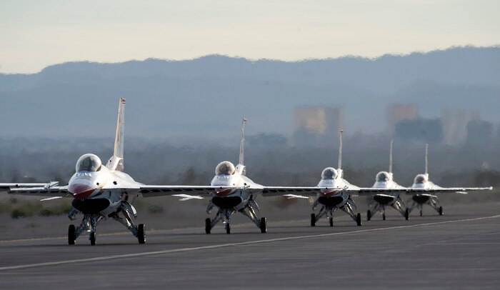 NELLIS AIR FORCE BASE, Nev. -- The U.S. Air Force Air Demonstration Squadron, the Thunderbirds, taxi in during the 2010 Aviation Nation Nellis Open House Nov. 14. The Nellis Open House is an opportunity for the Las Vegas community to view aerial demonstrations and static displays of various aircraft from the military. The open house also acts as the final air show of the year for the U.S. Air Force Air Demonstration Squadron, "Thunderbirds." (U.S. Air Force photo by Senior Airman Brett Clashman)(Released)