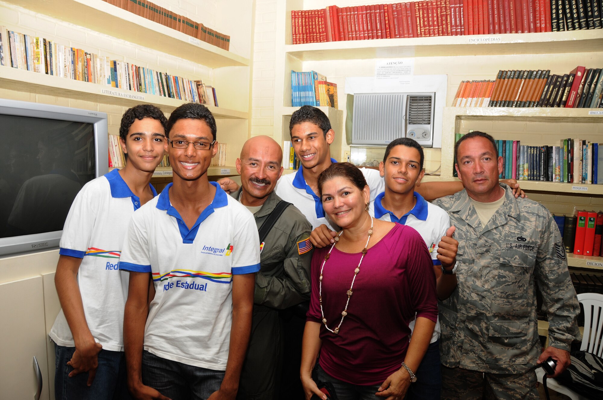 master Sgt. Johnny Narro and Technical Sgt. Guillermo Celaya from 161st Air Refueling Wing, Phoenix, Ariz., pose with students and their teacher Giselda Vila Nova from Escola Santos Dumont School on November 11, 2010, in Recife, Brazil . The 161st ARW is participating in CRUZEX V, or Cruzeiro Do Sul (Southern Cross).  CRUZEX  is a multi-national combined exercise involving the Air Forces of Argentina, Brazil, Chile, France and Uruguay, and observers from numerous other countries with more than 82 aircraft and almost 3,000 Airmen involved.  U.S. Air Force Photo by Master Sgt. Kelly M. Deitloff