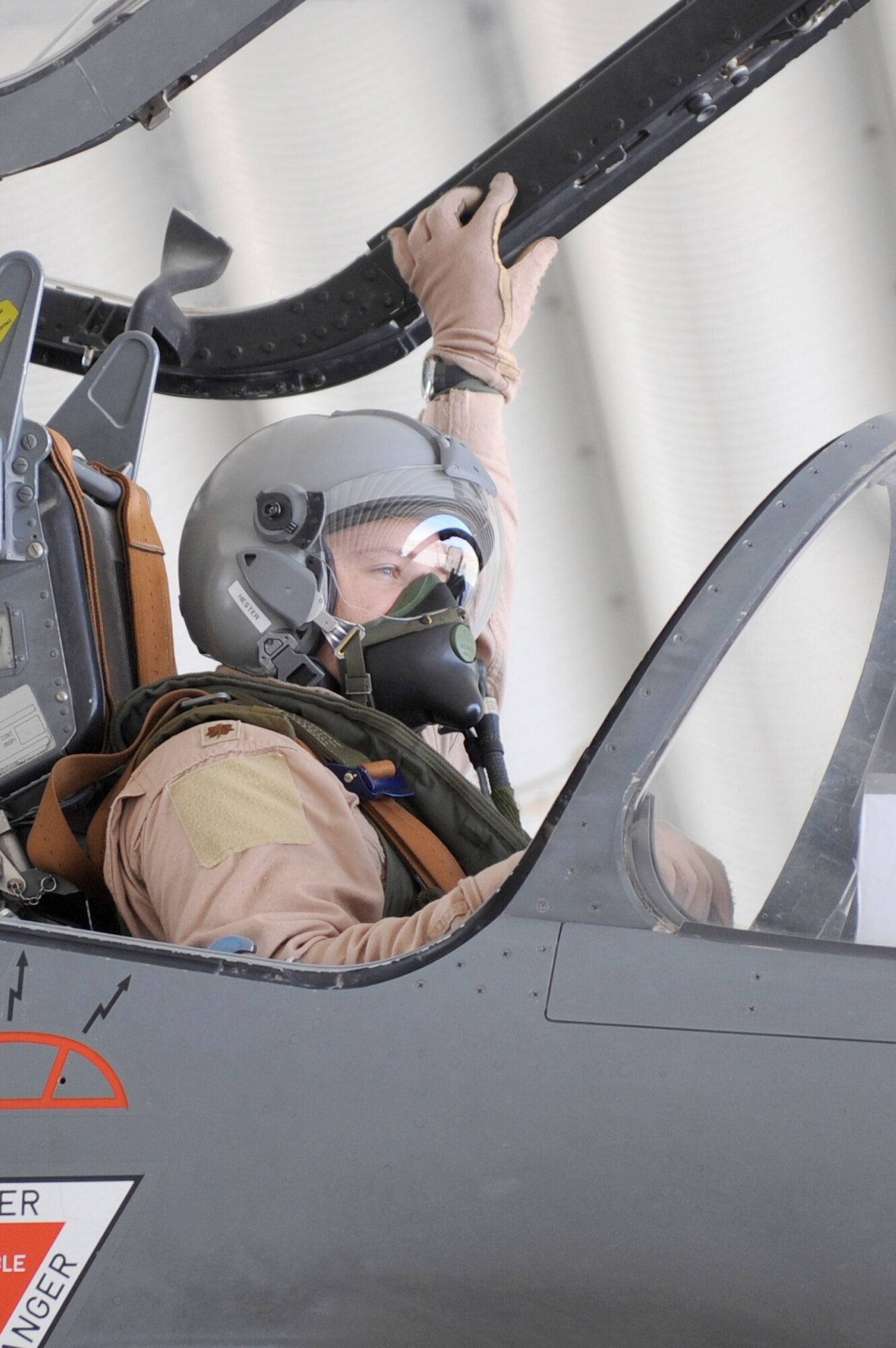 Major Skyler Hester closes the Mirage 2000D canopy before departing for a combat mission Nov. 11, 2010, at Kandahar Airfield, Afghanistan. Major Hester is an instructor pilot assigned to the French 1/3 Fighter Squadron. He is deployed with the French unit as part of the three-year foreign exchange pilot program. (U.S. Air Force photo/Tech. Sgt. Chad Chisholm)