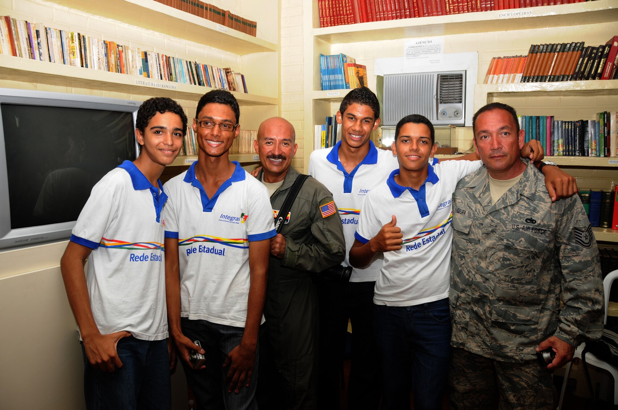 Master Sgt. Johnny Narro and Technical Sgt. Guillermo Celaya from 161st Air Refueling Wing, Phoenix, Ariz., pose with students from Escola Santos Dumont School on November 11, 2010, in Recife, Brazil . The 161st ARW is participating in CRUZEX V, or Cruzeiro Do Sul (Southern Cross).  CRUZEX  is a multi-national combined exercise involving the Air Forces of Argentina, Brazil, Chile, France and Uruguay, and observers from numerous other countries with more than 82 aircraft and almost 3,000 Airmen involved.  U.S. Air Force Photo by Master Sgt. Kelly M. Deitloff