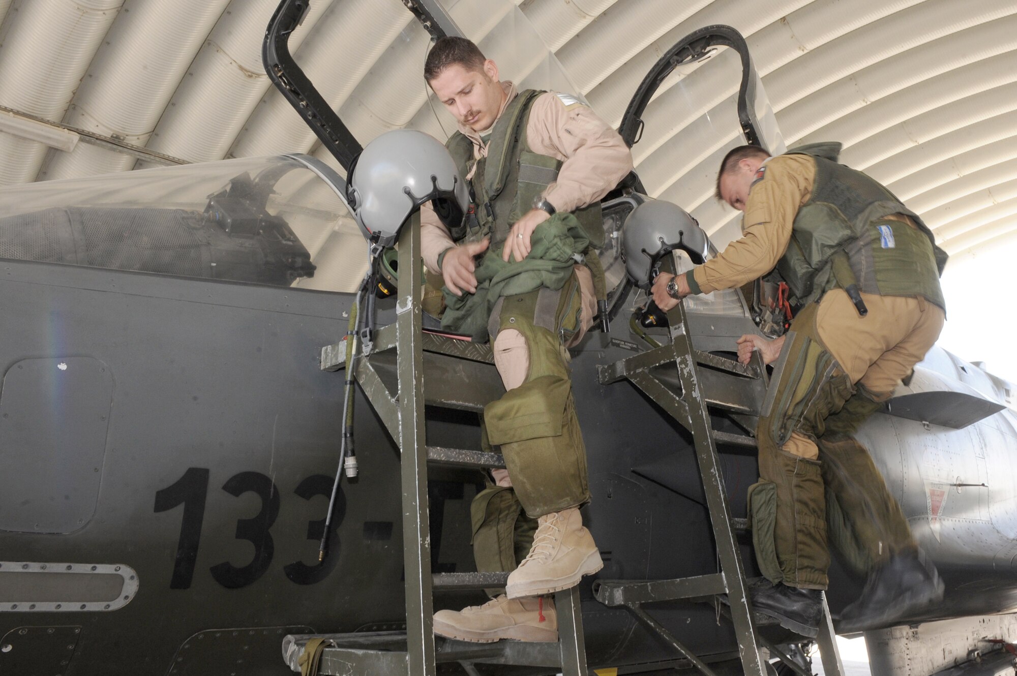 Maj. Skyler Hester and French air force Capt. Mathieu Boireau prepare to leave for a combat mission in a Mirage 2000D Nov. 11, 2010, at Kandahar Airfield, Afghanistan. Major Hester is an instructor pilot assigned to the French 1/3 Fighter Squadron. He is deployed with the French unit as part of the three-year foreign exchange pilot program. (U.S. Air Force photo/Tech. Sgt. Chad Chisholm)