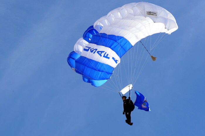 NELLIS AIR FORCE BASE, Nev.-- A U.S. Air Force Academy parachute team, Wings of Blue, team member displays the Air Force flag during the 2010 Aviation Nation Nellis Open House Nov. 14. The Open House is an opportunity for the Las Vegas community to view aerial demonstrations and static displays of various aircraft from the military. The open house also acts as the final air show of the year for the U.S. Air Force Air Demonstration Squadron, "Thunderbirds."  (U.S Air Force Photo / Airman 1st Class Matthew Lancaster) (Released)