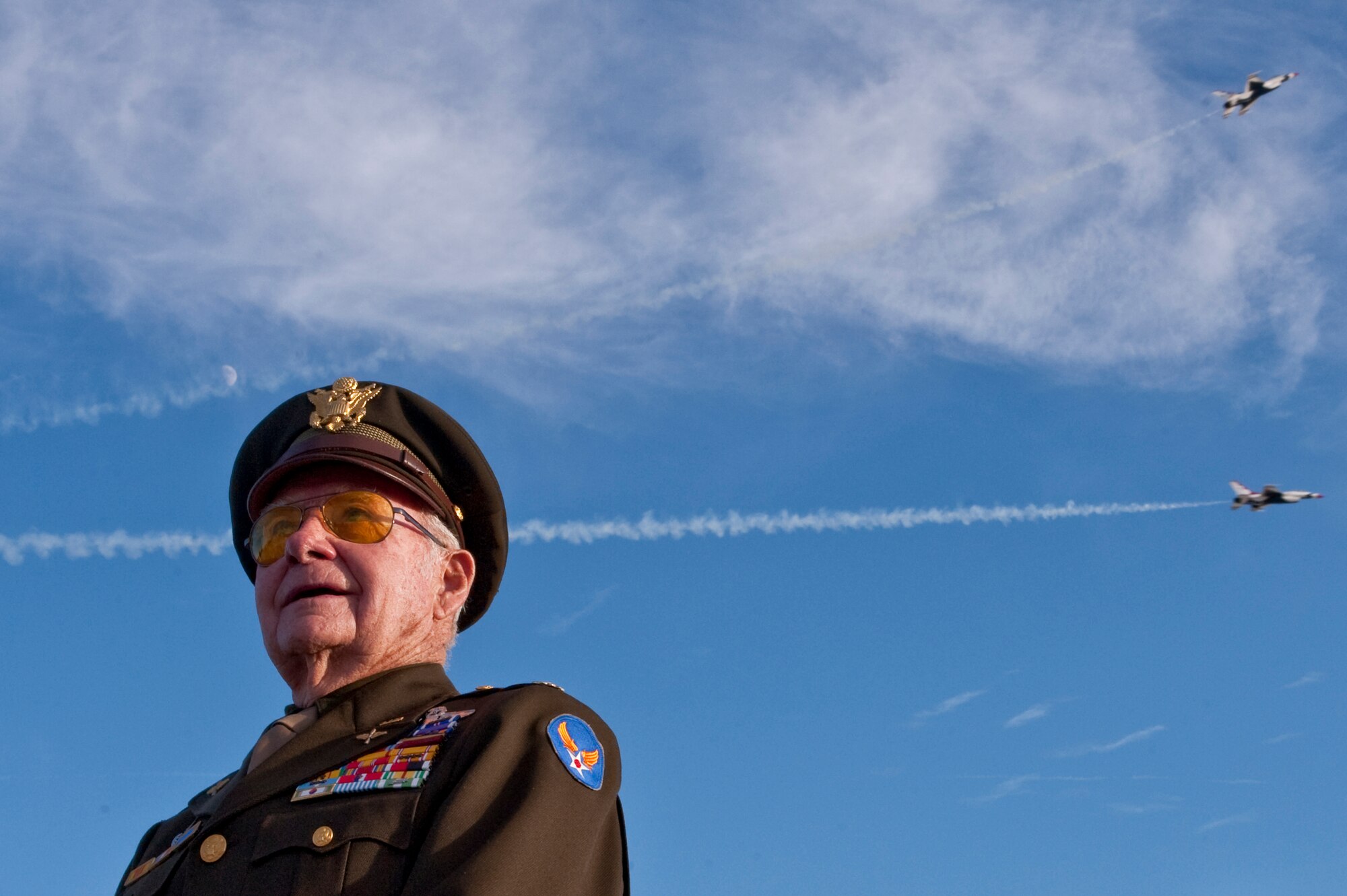 NELLIS AIR FORCE BASE, Nev. --   World War II, Korean War, and Vietnam Fighter Pilot U.S. Air Force Retired Maj.Dick Wyatt poses for a photo as the U.S. Air Force Air Demonstration Squadron, "Thunderbirds," perform at the 2010 Aviation Nation Nellis Open House Nov. 14.  The Nellis Open House is an opportunity for the Las Vegas community to view aerial demonstrations and static displays of various aircraft from the military. The open house also acts as the final air show of the year for the U.S. Air Force Air Demonstration Squadron "Thunderbirds." (U.S. Air Force photo by Tech. Sgt. Michael R. Holzworth)(Released)
