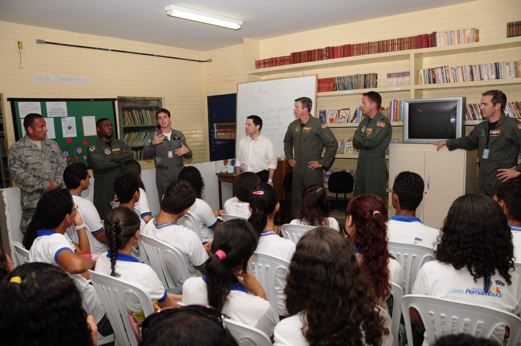 LT Spiller of the Brazilian Air Force and members of the 161st Air Refueling Wing, Phoenix, Ariz., talk with students from Escola Santos Dumont School on November 11, 2010, in Recife, Brazil . The 161st ARW is participating in CRUZEX V, or Cruzeiro Do Sul (Southern Cross).  CRUZEX  is a multi-national combined exercise involving the Air Forces of Argentina, Brazil, Chile, France and Uruguay, and observers from numerous other countries with more than 82 aircraft and almost 3,000 Airmen involved.  U.S. Air Force Photo by Master Sgt. Kelly M. Deitloff