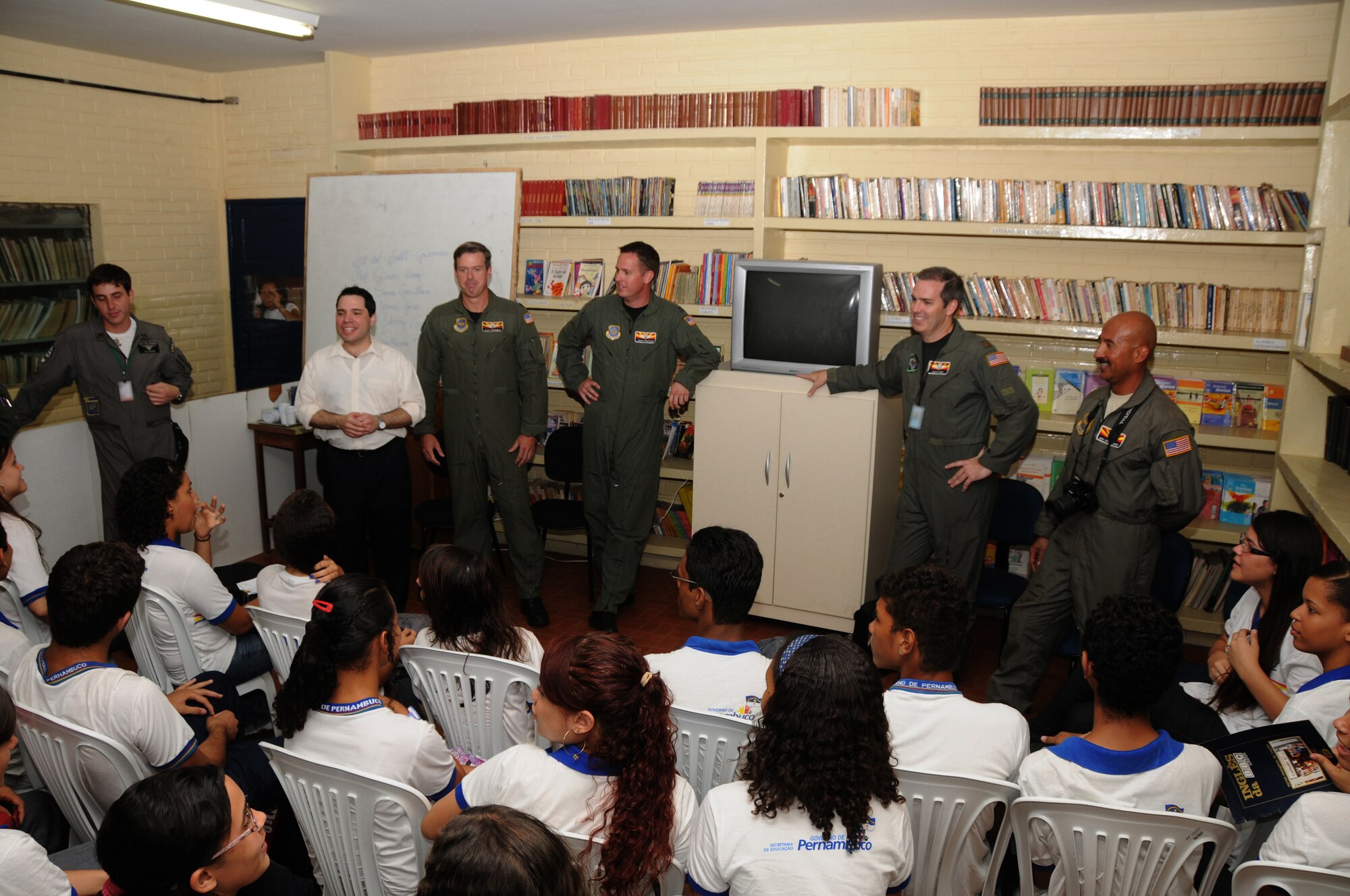 Members from the 161st Air Refueling Wing, Phoenix, Ariz., talk with students from Escola Santos Dumont School on November 11, 2010, in Recife, Brazil . The 161st ARW is participating in CRUZEX V, or Cruzeiro Do Sul (Southern Cross).  CRUZEX  is a multi-national combined exercise involving the Air Forces of Argentina, Brazil, Chile, France and Uruguay, and observers from numerous other countries with more than 82 aircraft and almost 3,000 Airmen involved.  U.S. Air Force Photo by Master Sgt. Kelly M. Deitloff