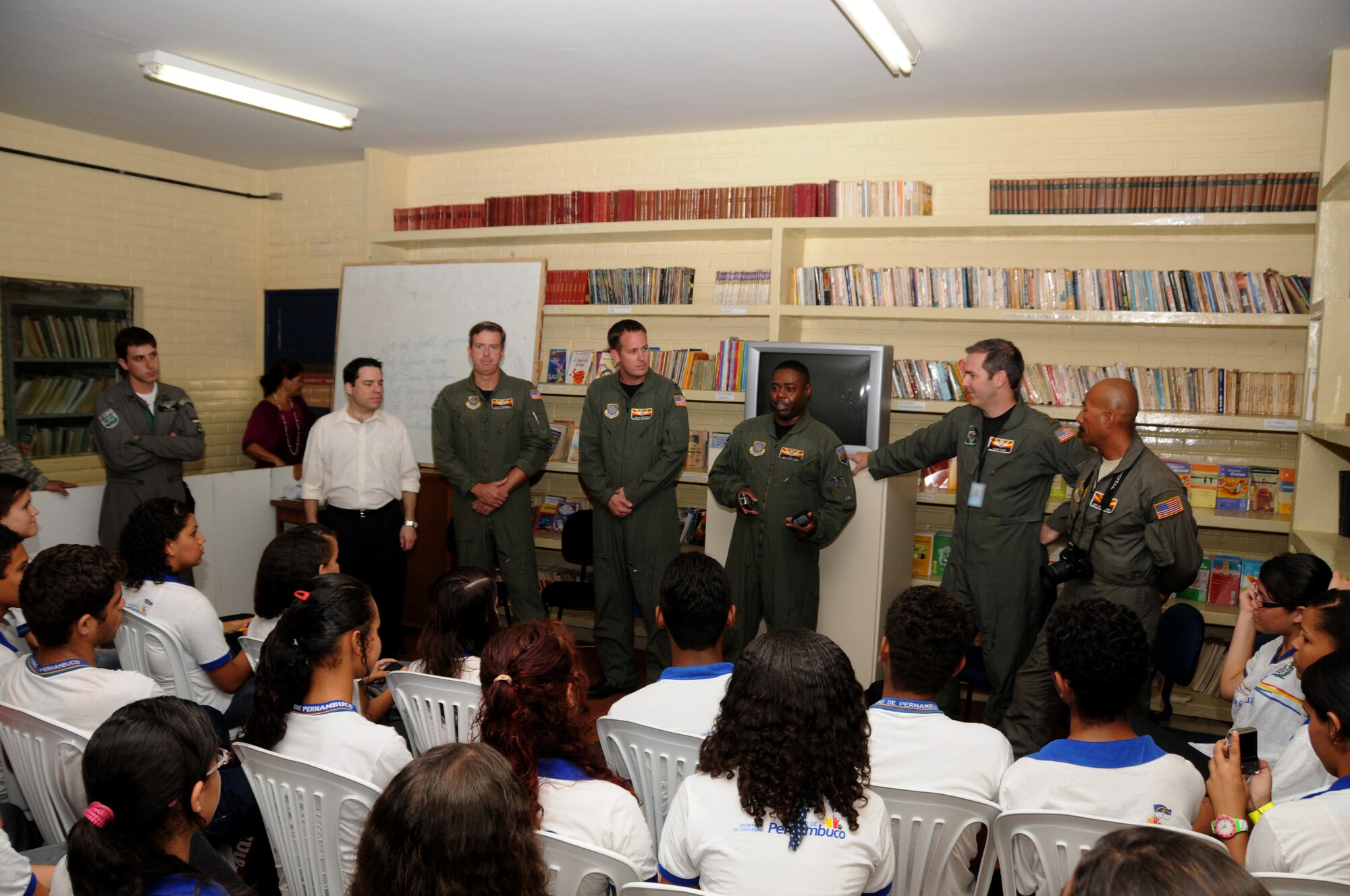 Members from the 161st Air Refueling Wing, Phoenix, Ariz., talk with students from Escola Santos Dumont School on November 11, 2010, in Recife, Brazil . The 161st ARW is participating in CRUZEX V, or Cruzeiro Do Sul (Southern Cross).  CRUZEX  is a multi-national combined exercise involving the Air Forces of Argentina, Brazil, Chile, France and Uruguay, and observers from numerous other countries with more than 82 aircraft and almost 3,000 Airmen involved.  U.S. Air Force Photo by Master Sgt. Kelly M. Deitloff