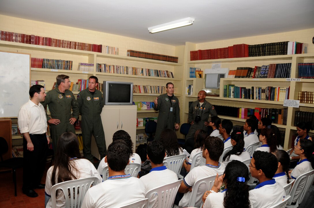 Members from the 161st Air Refueling Wing, Phoenix, Ariz., talk with students from Escola Santos Dumont School on November 11, 2010, in Recife, Brazil . The 161st ARW is participating in CRUZEX V, or Cruzeiro Do Sul (Southern Cross).  CRUZEX  is a multi-national combined exercise involving the Air Forces of Argentina, Brazil, Chile, France and Uruguay, and observers from numerous other countries with more than 82 aircraft and almost 3,000 Airmen involved.  U.S. Air Force Photo by Master Sgt. Kelly M. Deitloff