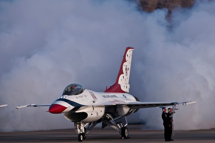NELLIS AIR FORCE BASE, Nev. --  U.S. Air Force Air Demonstration Squadron, "Thunderbirds," release smoke and prepare to exit their F-16's at the 2010 Aviation Nation Nellis Open House Nov. 14. The Nellis Open House is an opportunity for the Las Vegas community to view aerial demonstrations and static displays of various aircraft from the military. The open house also acts as the final air show of the year for the  U.S. Air Force Air Demonstration Squadron "Thunderbirds." (U.S. Air Force photo by Tech. Sgt. Michael R. Holzworth)(Released)