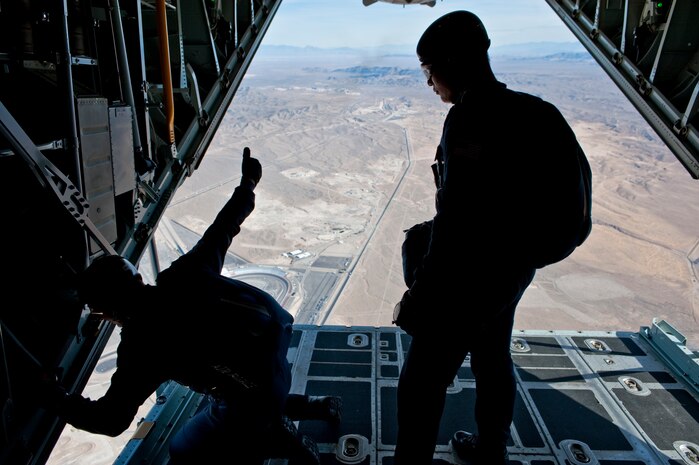 NELLIS AIR FORCE BASE, Nev. --  Master Sgt. Mike Kendrick with the  U.S. Air Force Academy parachute team, Wings of Blue, jump master gives U.S. Air Force Academy Cadet 1st Class Alan Wong a thumbs up, letting him know that he is cleared to jump during the 2010 Aviation Nation Nellis Open House Nov. 14. Cadet 1st Class Alan Wong is senior at the Air Force Academy and is currently slated to become a pilot. The Nellis Open House is an opportunity for the Las Vegas community to view aerial demonstrations and static displays of various aircraft from the military. The open house also acts as the final air show of the year for the  U.S. Air Force Air Demonstration Squadron "Thunderbirds." (U.S. Air Force photo by Tech. Sgt. Michael R. Holzworth)(Released)