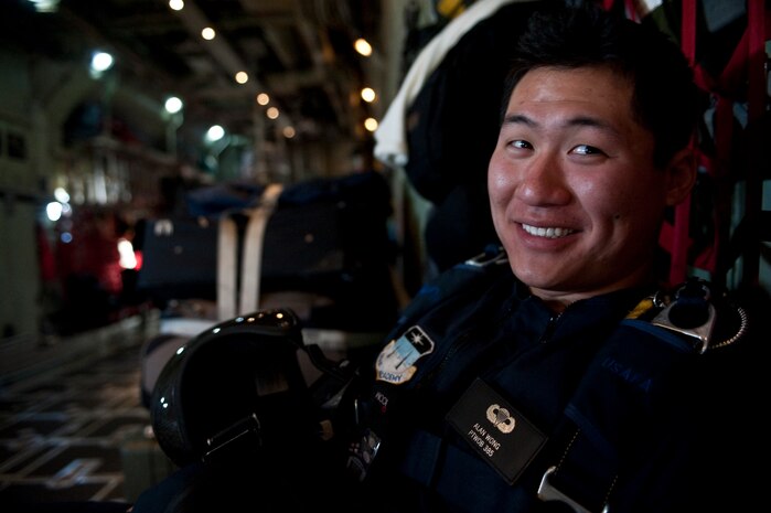 NELLIS AIR FORCE BASE, Nev. --  U.S. Air Force Academy Cadet 1st Class Alan Wong with the U.S. Air Force Academy parachute team, Wings of Blue, poses for a photo in the back of a C-130 Hercules over Nellis AFB during the 2010 Aviation Nation Nellis Open House Nov. 14. The Nellis Open House is an opportunity for the Las Vegas community to view aerial demonstrations and static displays of various aircraft from the military. The open house also acts as the final air show of the year for the  U.S. Air Force Air Demonstration Squadron "Thunderbirds." (U.S. Air Force photo by Tech. Sgt. Michael R. Holzworth)(Released)