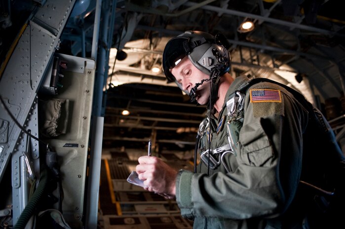 NELLIS AIR FORCE BASE, Nev. --  Staff Sgt. William H. Oxenford, 30th Airlift Squadron, Wyoming Air National Guard C-130 Hercules loadmaster writes down wind speed information while flying above Nellis AFB for the 2010 Aviation Nation Nellis Open House Nov. 14. The Wyoming ANG flew missions in support of the U.S. Air Force Academy parachute team, Wings of Blue. The Nellis Open House is an opportunity for the Las Vegas community to view aerial demonstrations and static displays of various aircraft from the military. The open house also acts as the final air show of the year for the U.S. Air Force Air Demonstration Squadron "Thunderbirds." (U.S. Air Force photo by Tech. Sgt. Michael R. Holzworth)(Released)